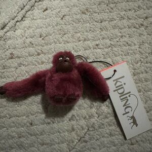 Burgundy Kipling keychain monkey